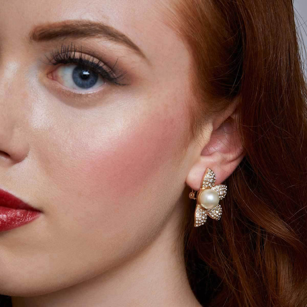 pearl flower clip earring by lovett and co pictured on a model.