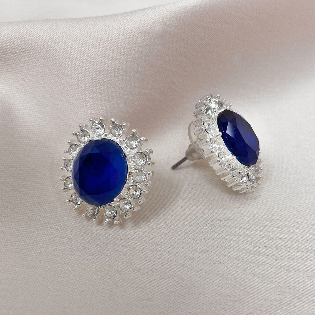 Lady Diana Inspired stud earrings, sapphire centre stone with a bed of crystals around the outside.