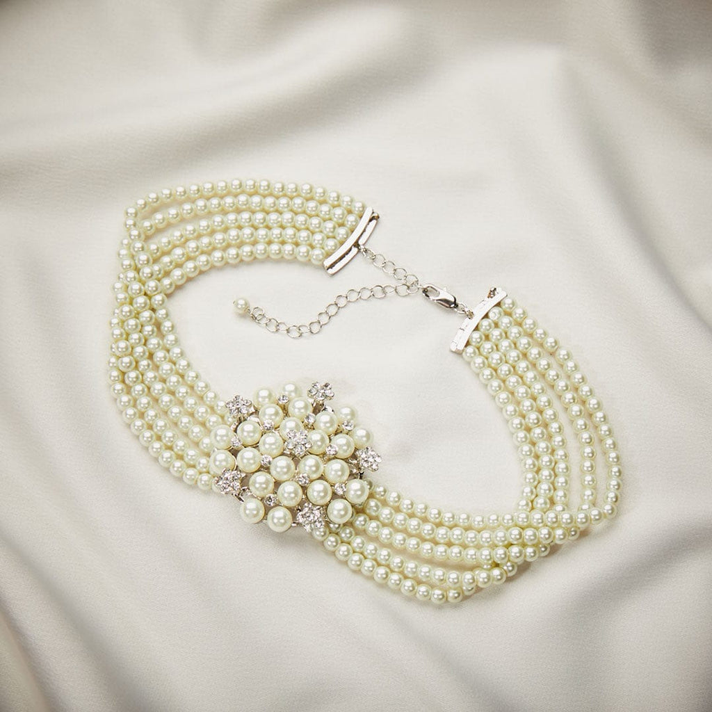 Audrey Hepburn Pearl Necklace inspired by Breakfast at Tiffanys. 5 rows of pearl and glass with a stunning centre piece